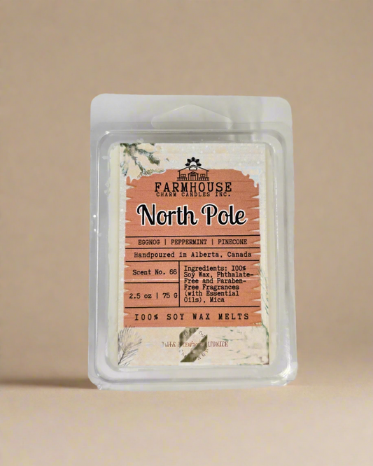 North Pole Wax Melts — creamy eggnog, cool peppermint, and pinecone scent soy wax melts displayed in a neutral background.