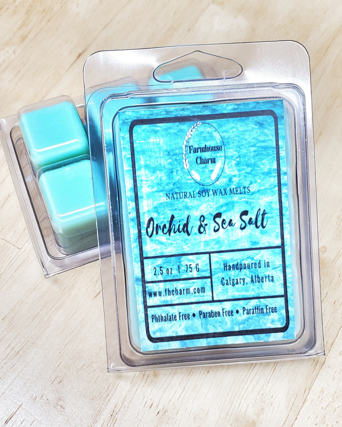 Orchid & Sea Salt Soy Wax Melts is a blend of soft florals of orchid with a touch of  jasmine and lily. It has a crisp aquatic highlights of sea salt mist that elevates the smooth and elegant aroma.  It is truly an invigorating scent! 2.5 oz net weight. Orchid & Sea Salt Soy Wax Melts is in a 6 cubes recyclable clamshell.  Orchid & Sea Salt Soy Wax Melts is made with natural soy wax. It is 100% plant-based and biodegradable. This wax melt is paraben free and phthalate free.  www.farmhousecharmcandles.com
