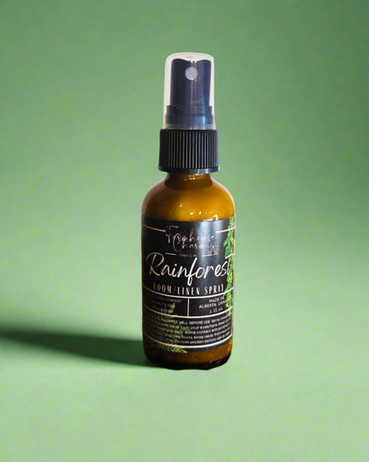 Step into a world of nostalgia with our Rainforest Room and &nbsp;Linen Spray. This delightful blend captures the essence of wandering through a lush rainforest, evoking memories of carefree adventures and hidden wonders. Picture yourself wandering through a verdant rainforest, surrounded by the sweet fragrance of jasmine blossoms in full bloom. The zesty citrus notes add a touch of brightness to your adventure, while the comforting scent of blond woods wraps you in a cozy embrace, like an old friend.