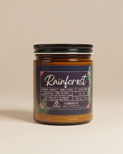 Jar of candle labeled 'Rainforest' on a beige background by Farmhouse Charm Candles