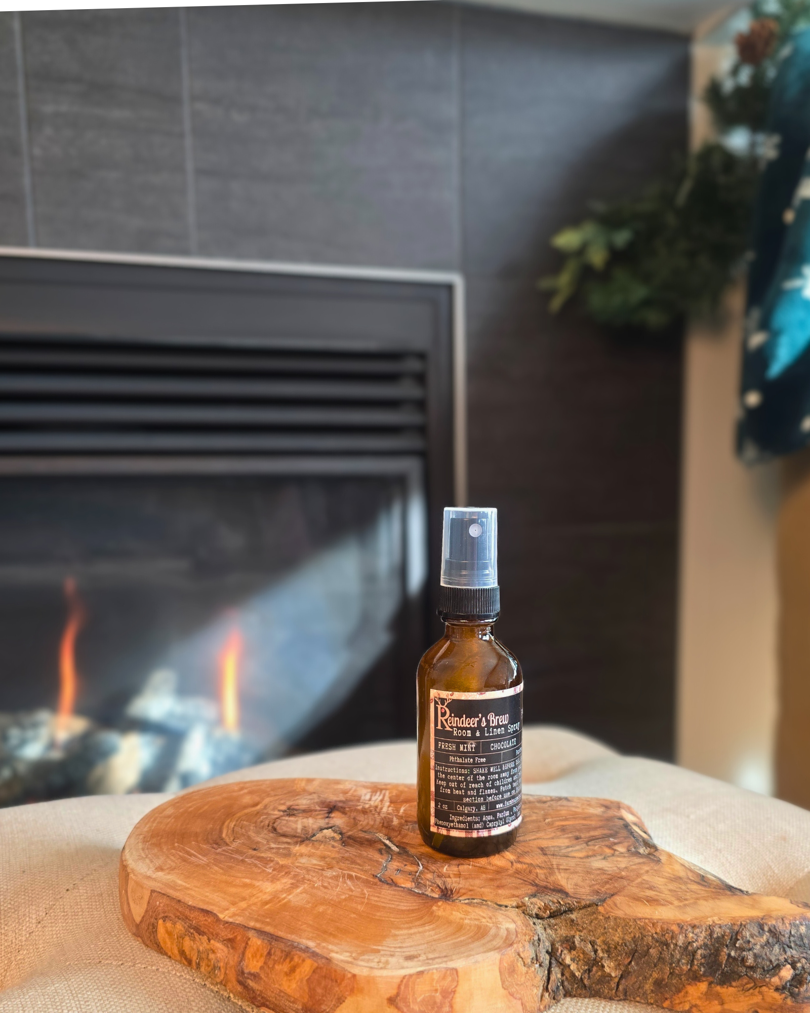 Reindeer’s Brew room and linen spray bottle — festive holiday scent from Farmhouse Charm Candles.