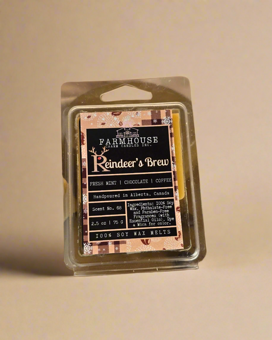 Reindeer’s Brew wax melts in festive shapes surrounded by coffee beans— cozy holiday fragrance from Farmhouse Charm Candles.