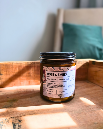 Jar of 'Rose & Ember' on a wooden surface with a blurred background by_Farmhouse_Charm_candles