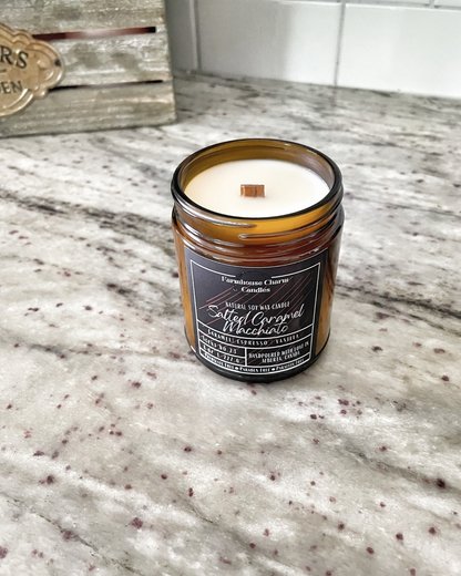 Savor the autumn season with a cozy sweater and a warm Salted Caramel Macchiato Soy Candle. For all the coffee lovers out there, the Salted Caramel Macchiato Soy Candle by Farmhouse Charm is the perfect addition to your fall routine. Infused with warm and rich aromas, this candle features a top note of caramelized sugar blended with roasted espresso, vanilla, salt, and spicy cinnamon.