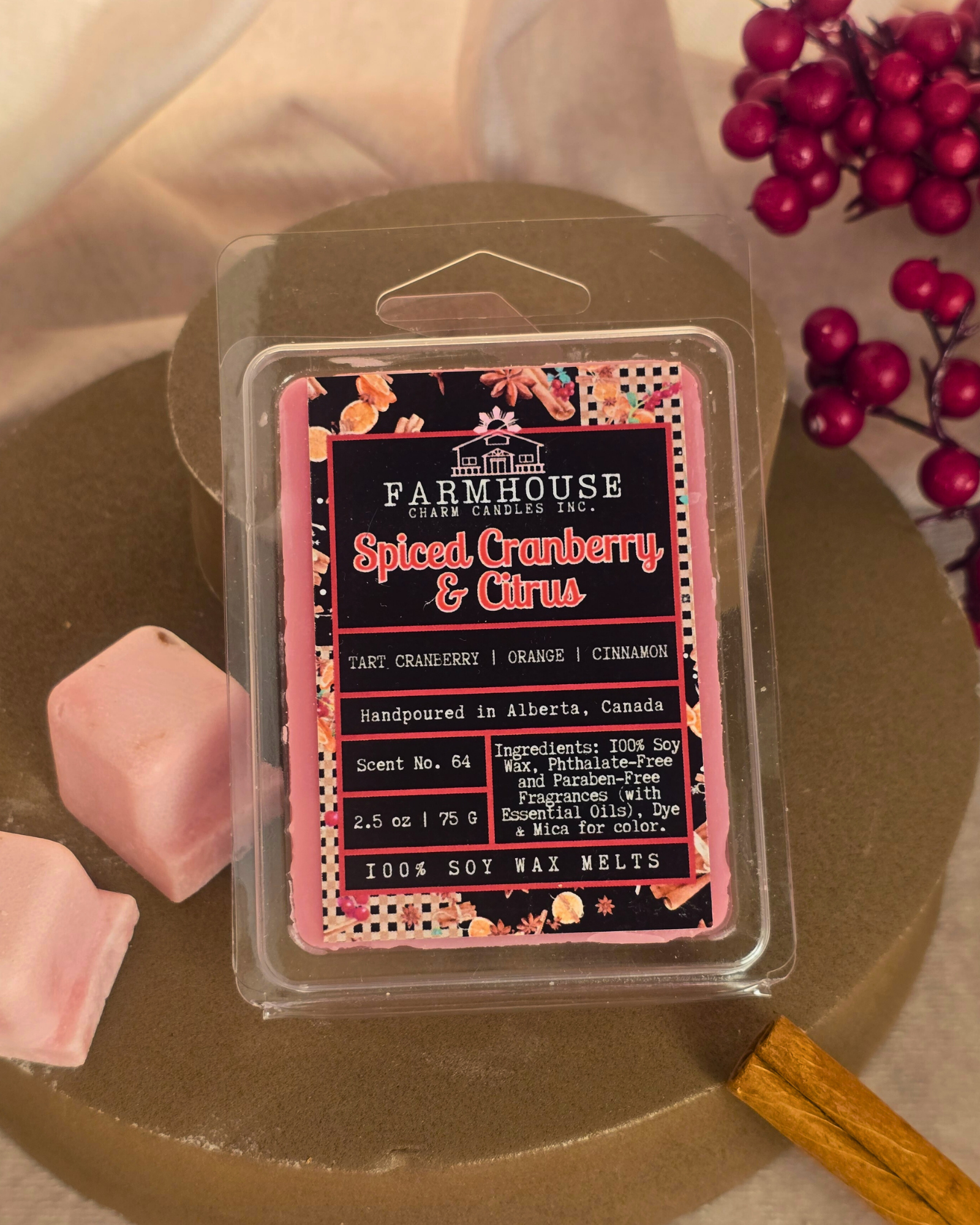 Spiced Cranberry & Citrus wax melts in wood style setting, featuring warm tones of red and orange with cozy holiday vibes — a festive blend of tart cranberry, sweet orange, and cinnamon