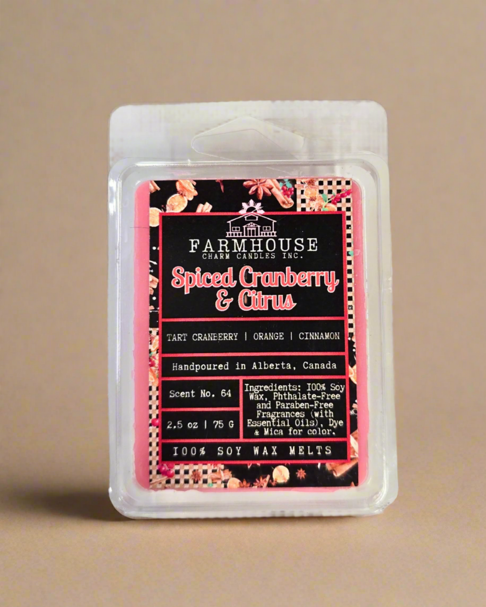 Spiced Cranberry & Citrus wax melts in wood style setting, featuring warm tones of red and orange with cozy holiday vibes — a festive blend of tart cranberry, sweet orange, and cinnamon