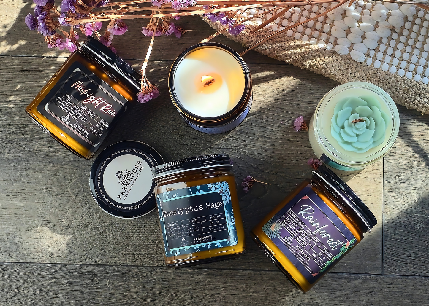 Collection of candles and jars with labels on a wooden surface. Spring Candle Set - Farmhouse Charm Candles