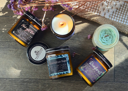 Collection of candles and jars with labels on a wooden surface. Spring Candle Set - Farmhouse Charm Candles