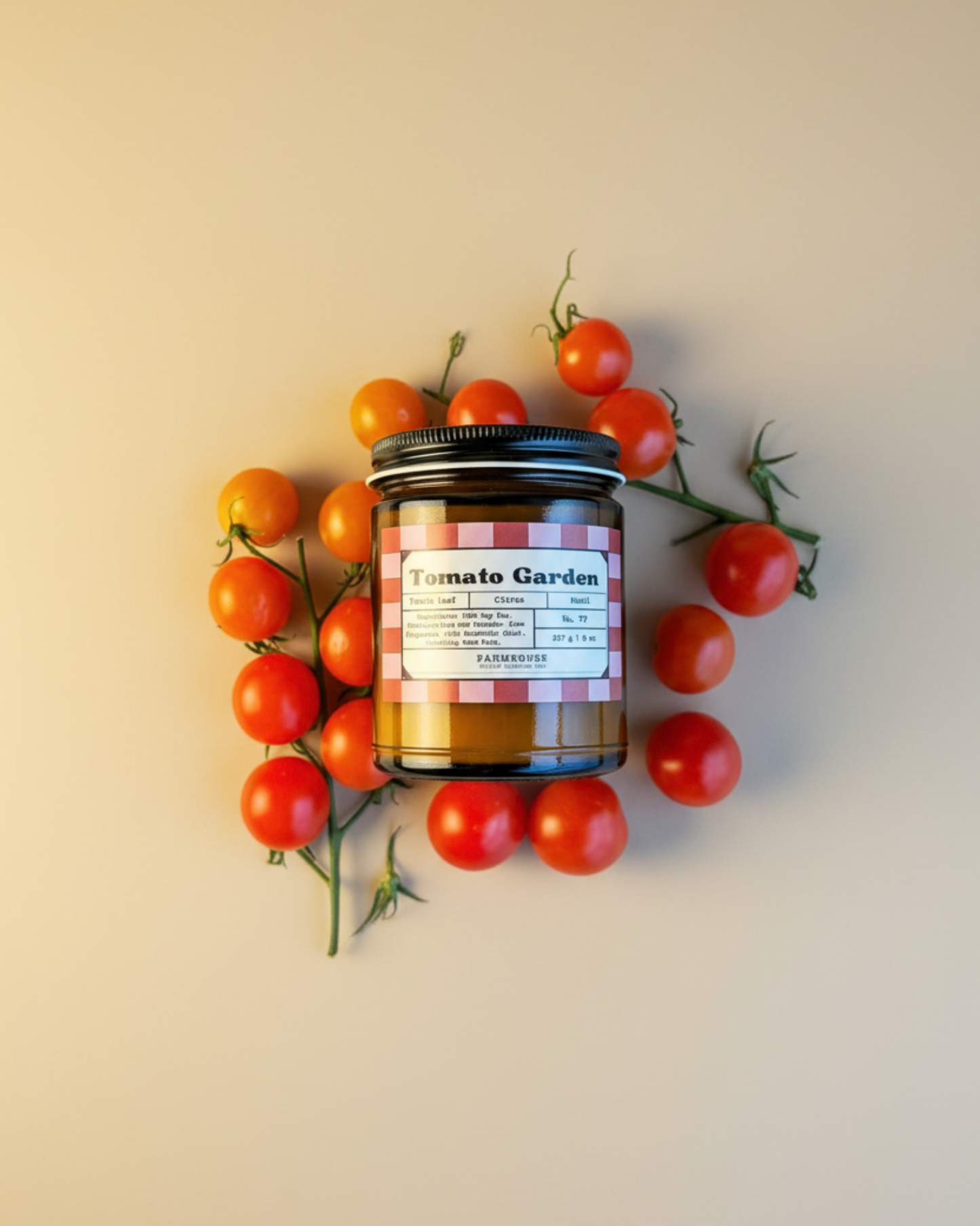 Jar labeled 'Tomato Garden' by Farmhouse Charm Candles surrounded by cherry tomatoes on a beige background