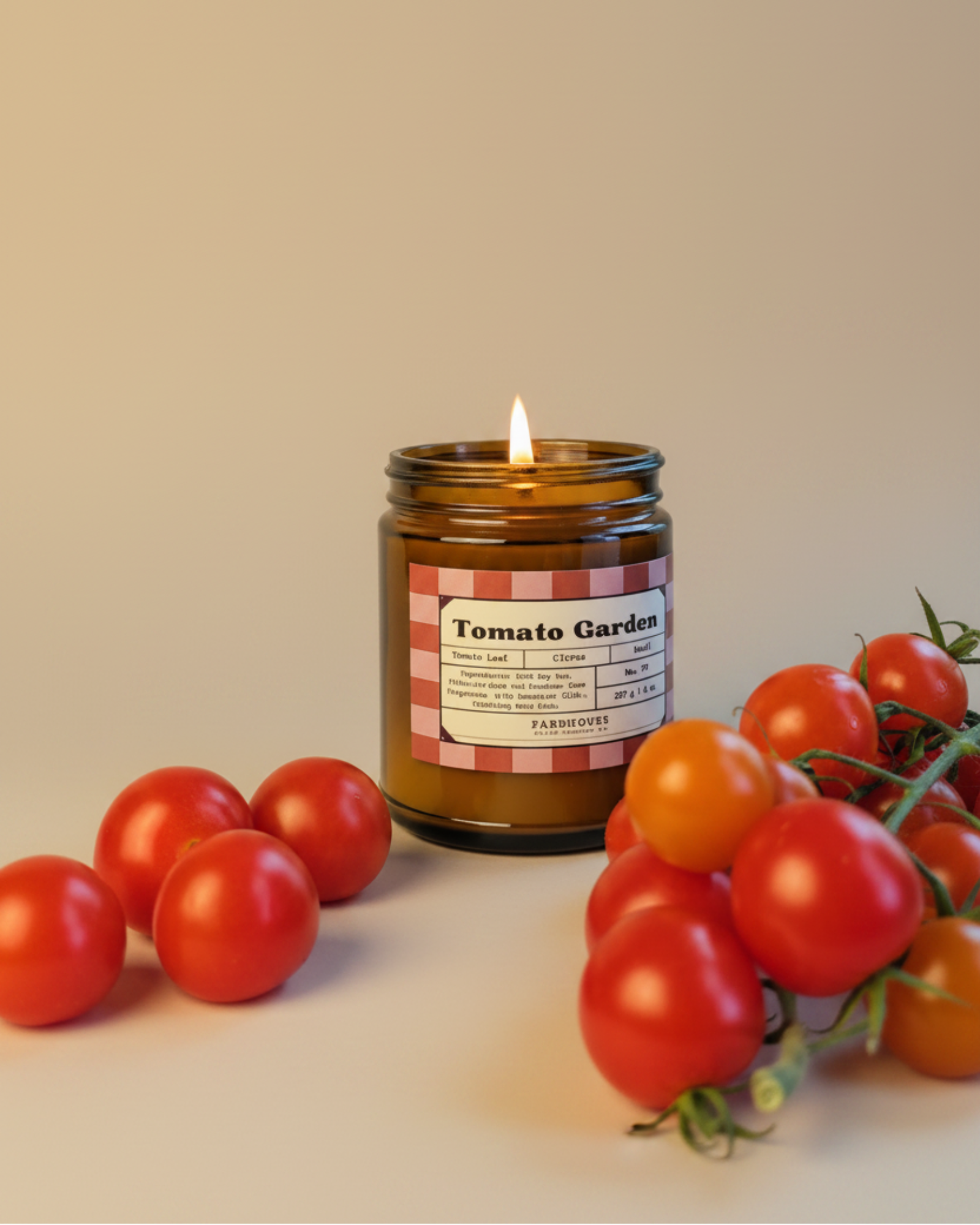 Candle labeled 'Tomato Garden' by Farmhouse Charm Candles with tomatoes and a vine on a beige background