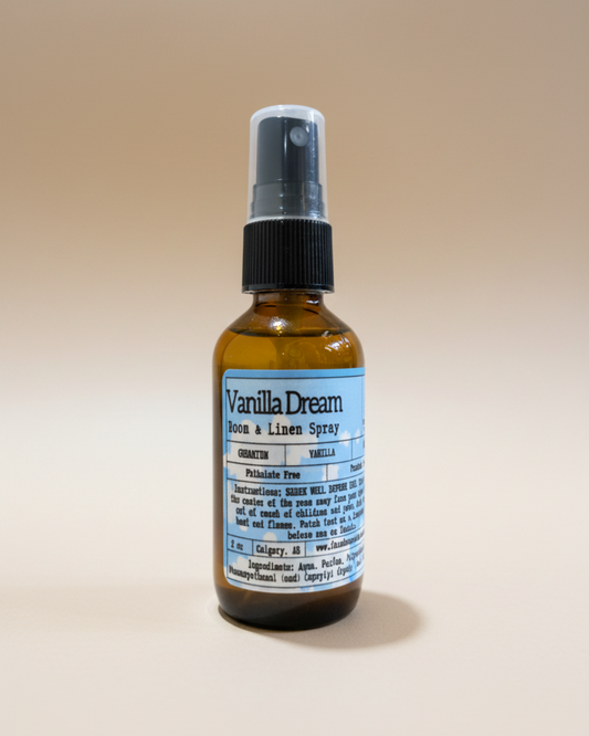 Bottle of Vanilla Dream room & Linen spray by Farmhouse Charm Candles on a beige background