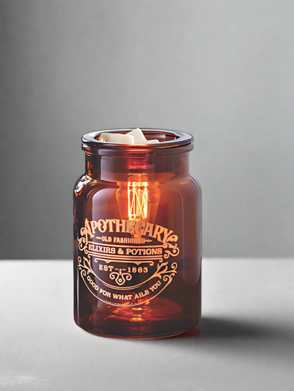 Amber glass Apothecary tart warmer with vintage Edison-style bulb, designed to melt wax safely while creating a cozy dark academia glow, perfect for farmhouse, modern, or traditional decor. www.farmhousecharmcandles.com