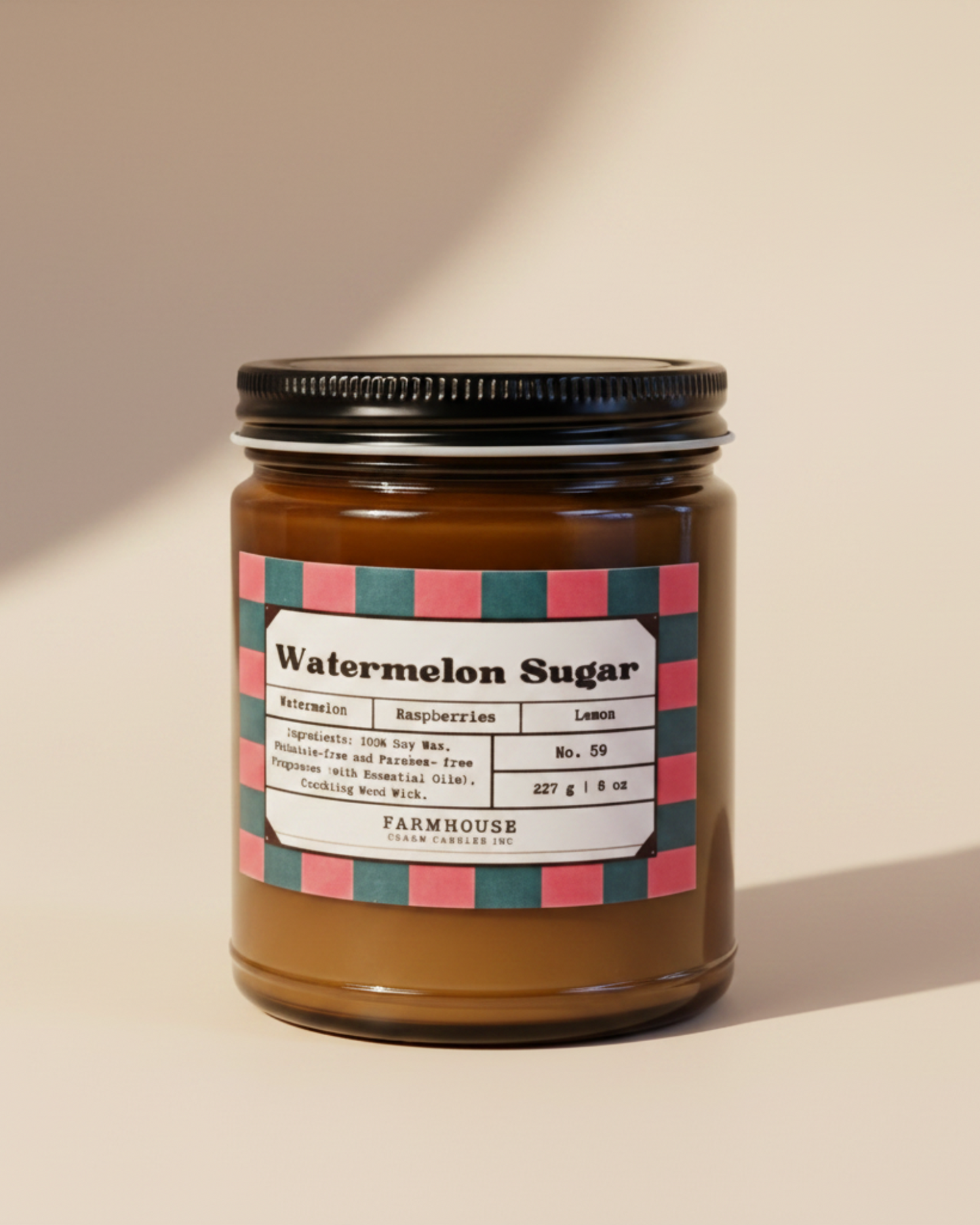 Jar of watermelon sugar soy candle by Farmhouse Charm Candles with a colorful label on a white background
