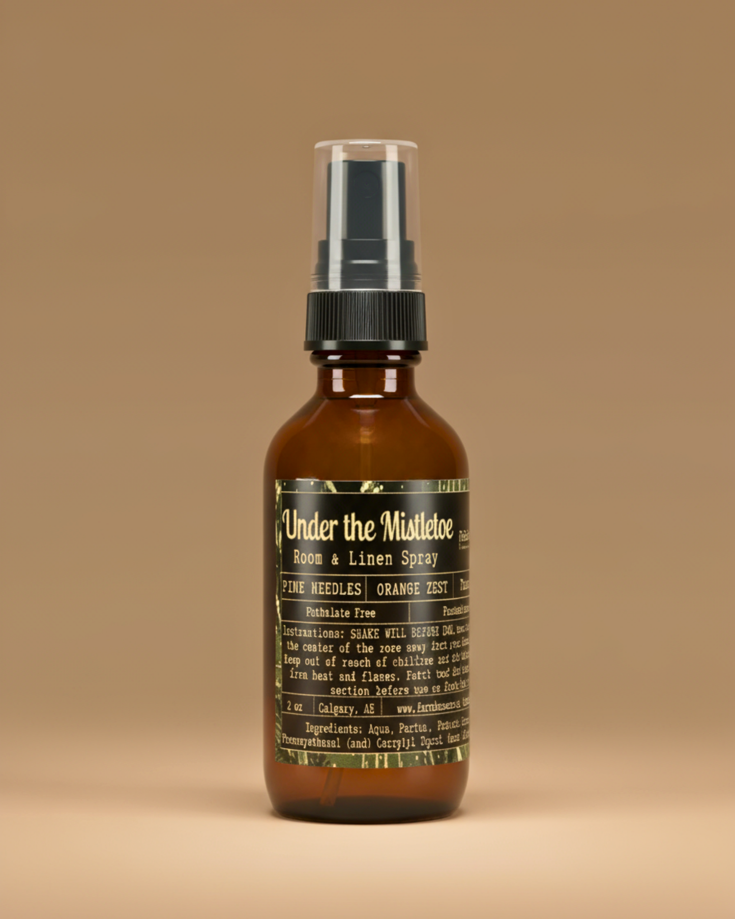 Brown spray bottle with label ' Under the Mistletoe by Farmhouse charm Candles on a beige background