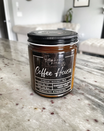 If you're someone who enjoys the scent of coffee in the morning, the Coffee House - Farmhouse Charm Soy Candle is definitely one to try. This candle boasts a rich, medium dark roast scent with subtle hints of caramel and vanilla. This candle is not only great for waking up your senses, but it's also perfect for creating a cozy and inviting atmosphere in your home. www.farmhousecharmcandles.com