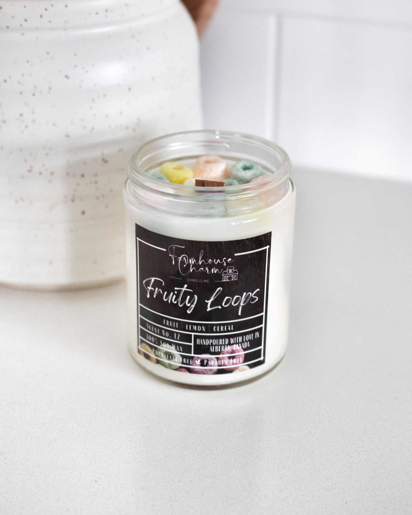    Indulge in the unique and nostalgic scent of Fruity Loops Soy Candle. This candle is bursting with a blend of sweet and tangy fruit, a hint of lemon, and the warm toasty aroma of cereal. Get ready to relive some of your fondest childhood memories!  Please note that decors on top may vary slightly from the photo due to the handmade nature of the candle. www.farmhousecharmcandles.com