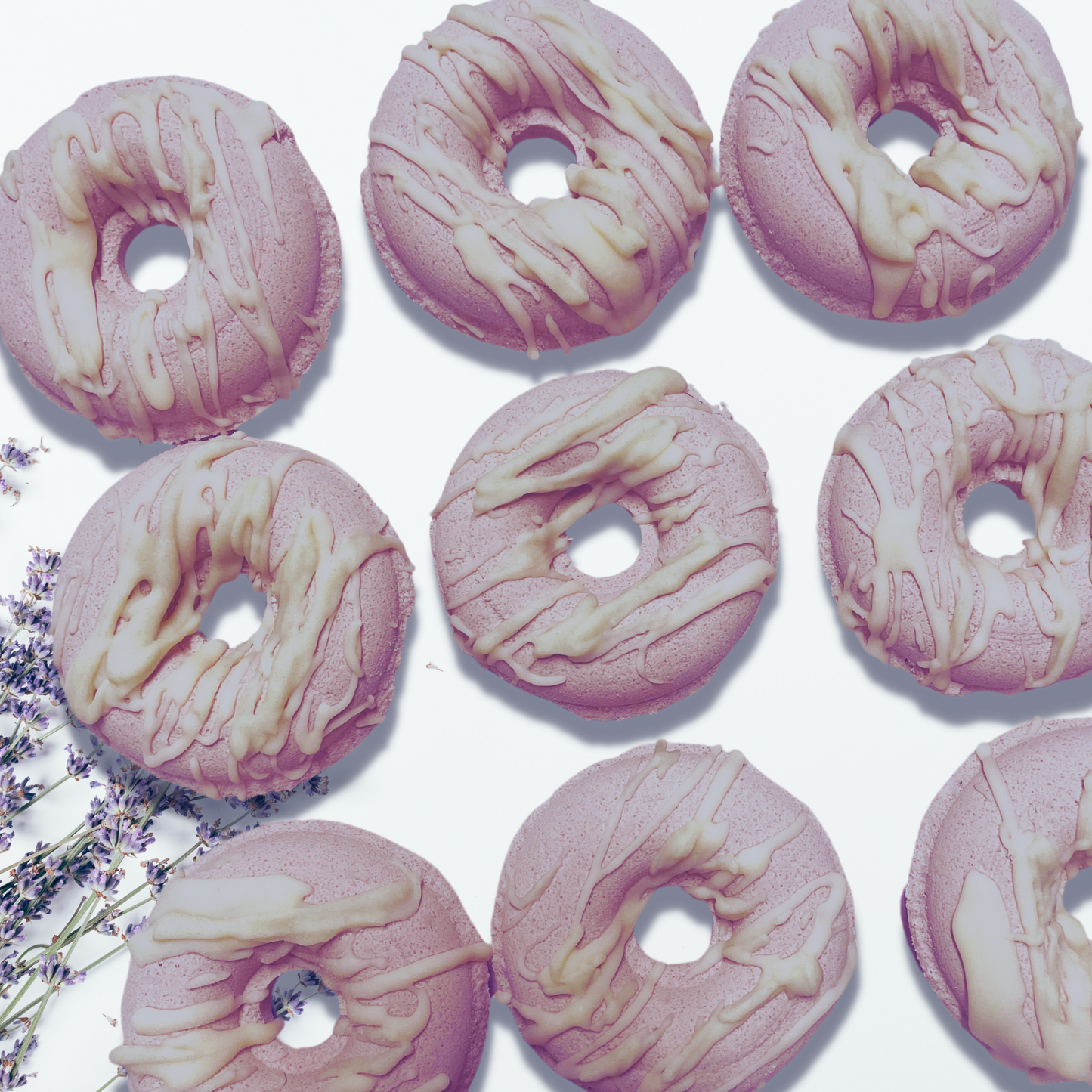 Lavender Field Donut Bath Bomb- Farmhouse Charm is made with plant-based ingredients and infused only with essential oils. This bath bomb uses Kaolin clay for color and contains moisturizing ingredients such as coconut oil, cocoa butter, and colloidal oatmeal. It does not contain any artificial colorants and fragrance. To Use: Drop or hold in bath water. Enjoy the fizzing action, wonderful aromas and nourishing oils.