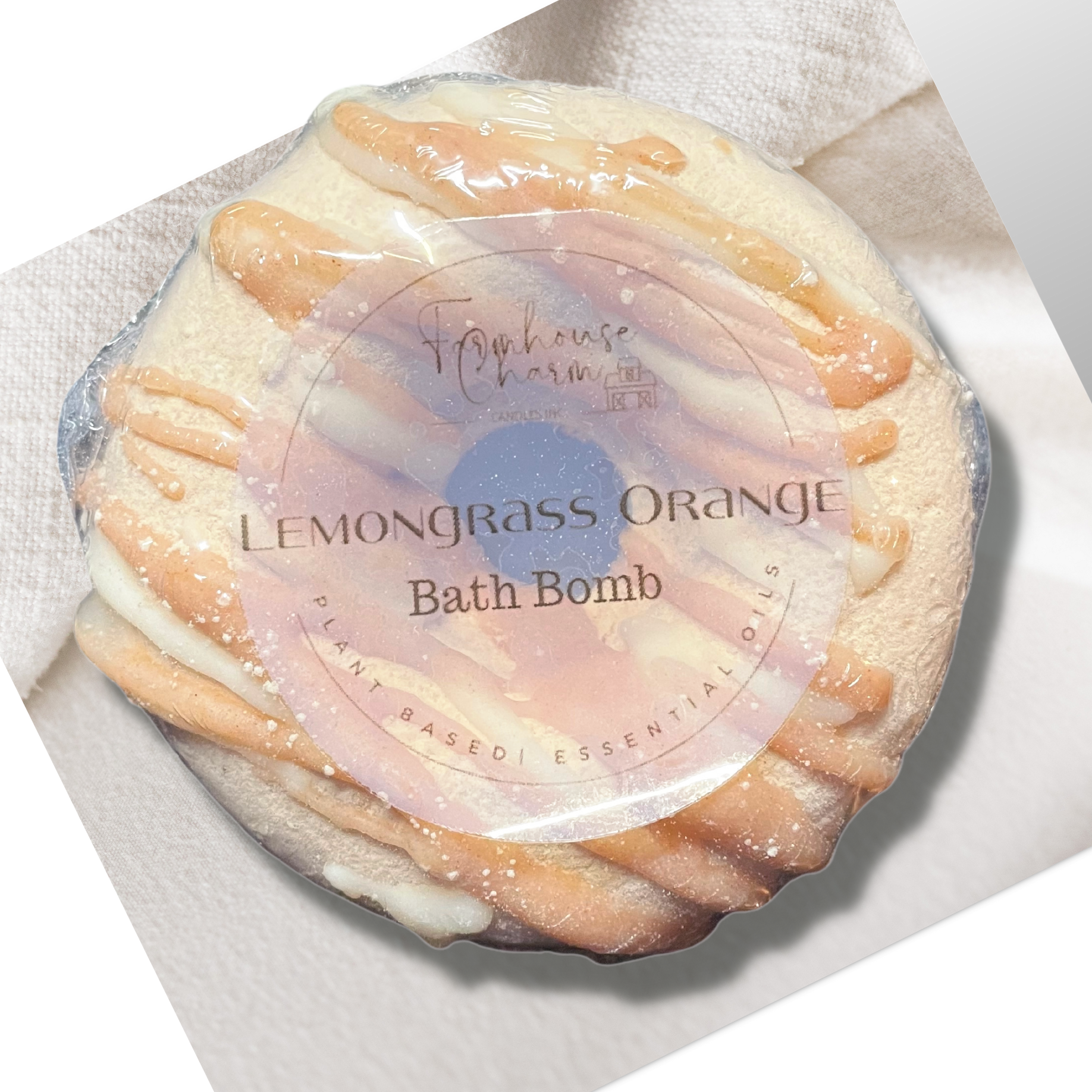 Lemongrass Orange Donut Bath Bomb- Farmhouse Charm is made with plant-based ingredients and infused only with essential oils. This bath bomb uses Kaolin clay for color and contains moisturizing ingredients such as coconut oil, cocoa butter, and colloidal oatmeal. It does not contain any artificial colorants and fragrance. To Use: Drop or hold in bath water. Enjoy the fizzing action, wonderful aromas and nourishing oils.