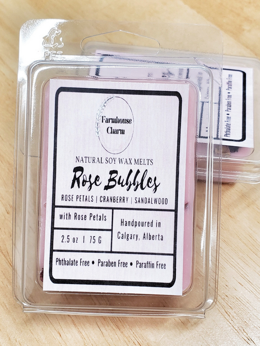 Roses through time have been a symbol of love and romance. Rose Bubbles Soy Wax Melts- Farmhouse Charm gives just the perfect balance of delicate fresh roses and sweet cranberry. The scent will fill your space with timeless sweet floral aroma. This wax melts is infused with dry rose petals to enhance the aroma.  size: 2.5 oz. (75 g)  Rose Bubbles Soy Wax Melts- Farmhouse Charm is made with 100% natural soy wax.  The candle is paraben free and phthalate free. 