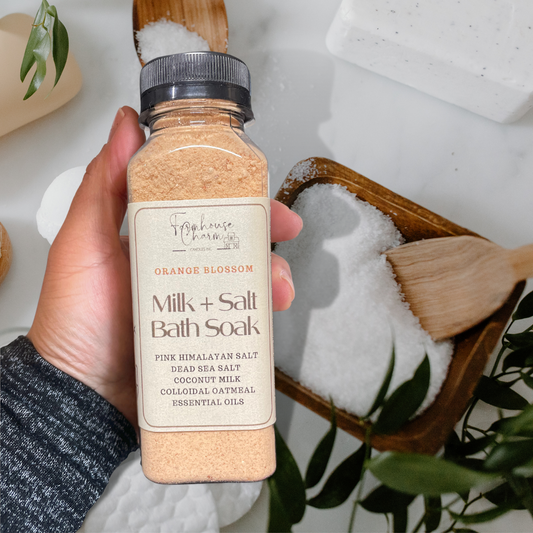 Farmhouse Charm Milk + Salt Bath Soak- Orange Blossom is a blend of salts, coconut milk and essential oils for a natural and soothing bath experience. It has no artificial colorants and fragrance. Pink Himalayan Salt Dead Sea Salt Colloidal Oatmeal To Use: Add 1/2 cup to bath water. Soak and enjoy!
