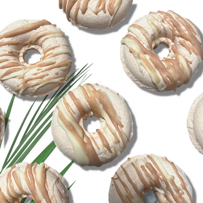 Lemongrass Orange Donut Bath Bomb- Farmhouse Charm is made with plant-based ingredients and infused only with essential oils. This bath bomb uses Kaolin clay for color and contains moisturizing ingredients such as coconut oil, cocoa butter, and colloidal oatmeal. It does not contain any artificial colorants and fragrance. To Use: Drop or hold in bath water. Enjoy the fizzing action, wonderful aromas and nourishing oils.