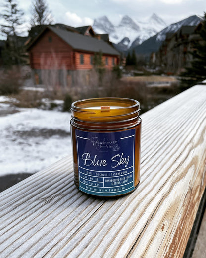 Blue Sky - Farmhouse Charm Soy Candle has a delightful blend of floral, coconut, and sandalwood scents that will fill your home with a calming atmosphere. Floral notes of fresh flowers and green botanicals create a soothing and inviting atmosphere, while the coconut and sandalwood create a warm and comforting ambience. Together, these  scents combine to create an atmosphere that evoke the feeling of a bright and sunny spring day!www.farmhousecharmcandles.com