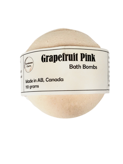 Grapefruit Pink Bath Bomb- Farmhouse Charm is made with all natural ingredients and infused with essential oils. Drop or hold in bath water. Enjoy the fizzing action, wonderful aromas and nourishing oils.