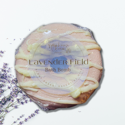 Lavender Field Donut Bath Bomb- Farmhouse Charm is made with plant-based ingredients and infused only with essential oils. This bath bomb uses Kaolin clay for color and contains moisturizing ingredients such as coconut oil, cocoa butter, and colloidal oatmeal. It does not contain any artificial colorants and fragrance. To Use: Drop or hold in bath water. Enjoy the fizzing action, wonderful aromas and nourishing oils.