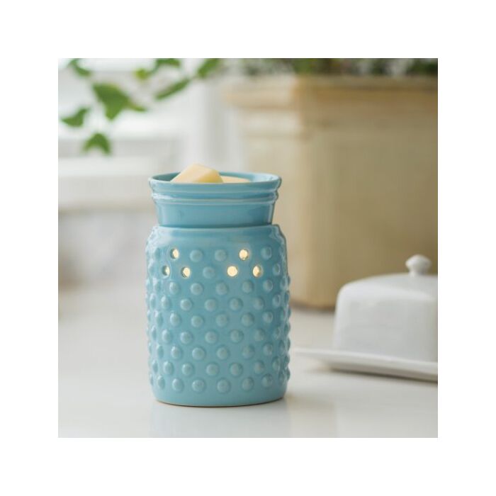 A sky blue glaze and hobnail pattern lets this versatile warmer go with either modern or traditional decor. The Midsize Illumination from Candle Warmers Etc. is a slightly smaller and more economical warmer. A perfect fit for cozier spaces in your home, this decorative fragrance warmer safely warms scented wax melts, releasing lasting fragrance throughout any room. Styled for your home, be it farmhouse or traditional or modern! 