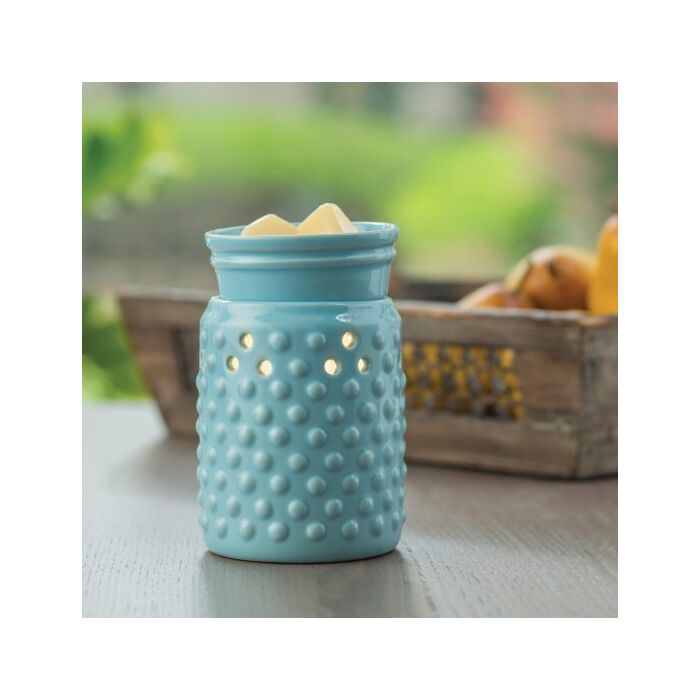 A sky blue glaze and hobnail pattern lets this versatile warmer go with either modern or traditional decor. The Midsize Illumination from Candle Warmers Etc. is a slightly smaller and more economical warmer. A perfect fit for cozier spaces in your home, this decorative fragrance warmer safely warms scented wax melts, releasing lasting fragrance throughout any room. Styled for your home, be it farmhouse or traditional or modern! 